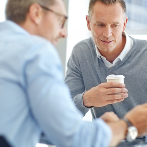 Expert showing member an outline on his phone